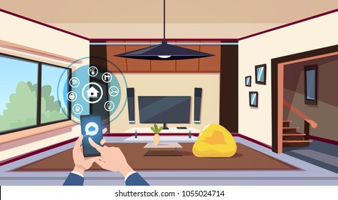 Hand Using Smart Home App Interface Of Control Panel Over Living Room Interior Modern Technology Of House Monitoring Concept