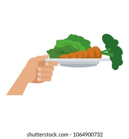 Hand with vegetables on dish