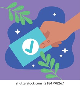 mano con tarjeta de voto y folletos