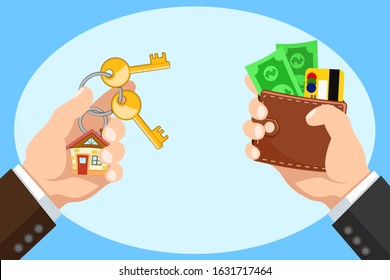 Hand with a wallet and keys to a new home, buying real estate.