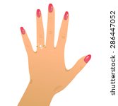 Hand wearing engagement ring and wedding ring.