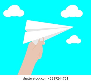 hand with white airplane on blue sky background