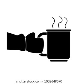 Hand with winter glove holding a mug