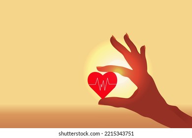 Hand of woman hold a heart with a cardiogram symbol on the sunrise background with copy space. Concept of life insurance. Health and medical insurance of people.