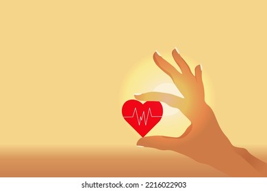 Hand of woman hold a heart with a cardiogram symbol on the sunrise background with copy space. Concept of life insurance. Health and medical insurance of people.