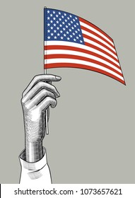 Hand of woman holding the USA flag. Vintage engraving stylized conceptual drawing. Vector illustration