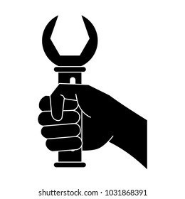 Hand with wrench