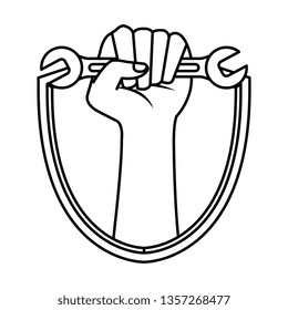 hand with wrench key in shield