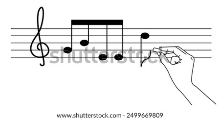 Hand write musical notes on the score. Musical composition or training or educational concept