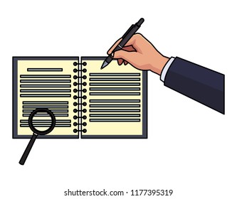 Hand writing on notebook with magnifying glass