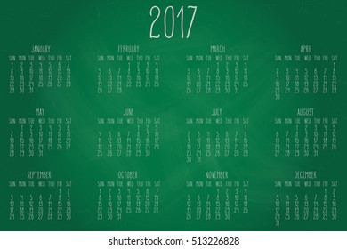 Hand written calendar for the year 2017 over green chalkboard background.