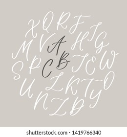 Hand written calligraphic alphabet with  uppercase letters. Modern vector lettering can be used for wedding invitations, posters, prints. Vector hand made font