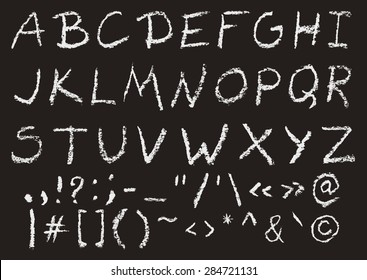 Hand written chalk uppercase english alphabet and most important punctuation marks on black background. Real chalk texture.