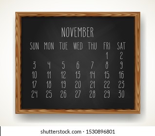 Hand written chalk vector calendar for November 2019 over black chalkboard background in a wooden frame.