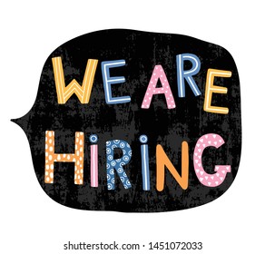 Hand written colorful letters with text - We are hiring in speech bubble in chackboard black color for creative jobs