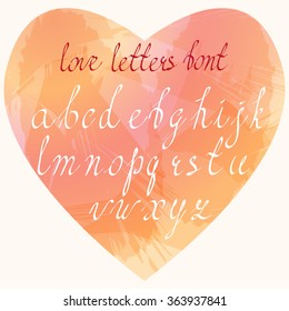 Hand written cursive Latin letters in lower case placed in heart shaped watercolor stains imitation. Handmade Love letters font. Clean, easy to edit.
