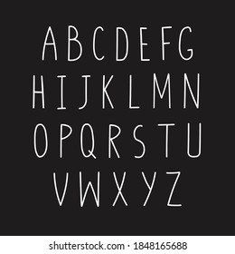 A hand written set of latin latters. Doodle alphabet. Blackboard background.