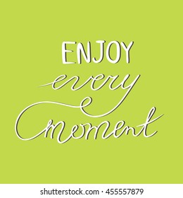 Hand written sign Enjoy every moment.
Phrase on a lime background.