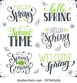 Hand written Spring time phrases in black and green. Greeting card text templates isolated on white background. Hello Spring lettering in modern calligraphy style. Spring wording.