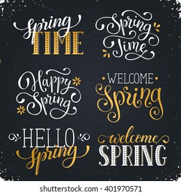 Hand written Spring time phrases in white and gold. Greeting card text templates on blackboard. Welcome Spring lettering in modern calligraphy style. Hello Spring wording.
