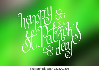 Hand written St. Patrick's day greetings over horizontal abstract smooth blur green background.