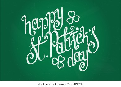 Hand written St. Patrick's day greetings over green chalkboard background.