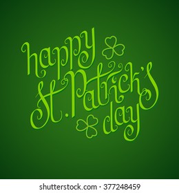 Hand written St. Patrick's day greetings over rich green background.