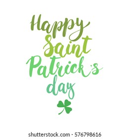 Hand written typography lettering phrase Happy Saint Patric's Day with clover on the white background . Modern calligraphy background for typography greeting with Happy Saint Patrick's Day