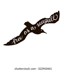 Hand written typography poster. Calligraphic quote "Free as a seagull" with seagull silhouette isolated on white.Vector illustration