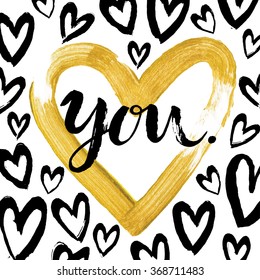 Hand written  Valentine Day card "You" with modern calligraphy, hand drawn gold painted  heart frame, ink painted hearts