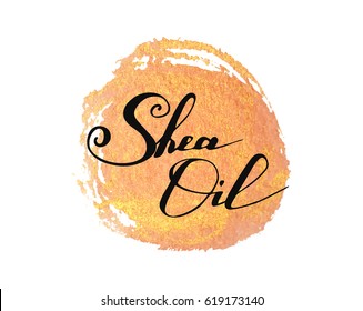 Hand Written Words Shea Oil On Golden Paint Splash On White Background