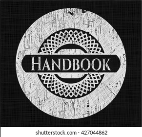 Handbook chalk emblem written on a blackboard