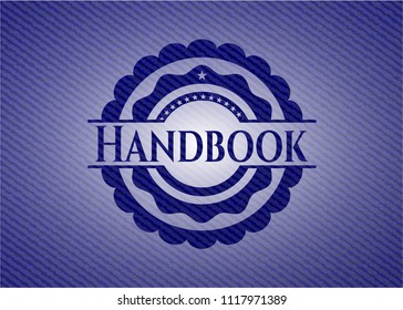 Handbook emblem with jean background