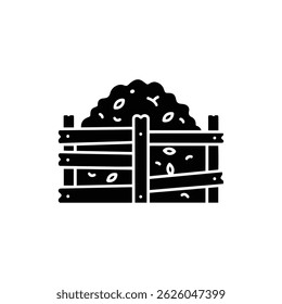 Hand-Constructed Compost Heap Surrounded by Wooden Planks Full of Garden Waste