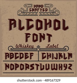 Handcrafted Alcohol font with whiskey label and decorations, dusty background