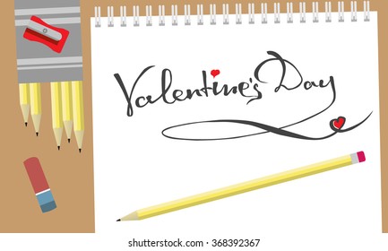 Hand-draw lettering, isolated on the white album surrounded by art supplies. Valentine's Day