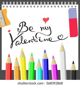 Hand-draw lettering, isolated on the white album surrounded by art supplies. Valentine's Day