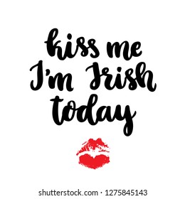 The hand-drawing fun inscription: Kiss me I am Irish today, of black ink on a white background, for St. Patrick's Day. It can be used for invitation card, brochures, poster and other promo materials.