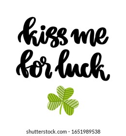 The hand-drawing fun inscription: Kiss me for luck, and shamrock, for St. Patrick's Day. It can be used for a sticker, patch, invitation card, brochures, poster and other promo materials.