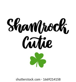 The hand-drawing funny inscription: Shamrock cutie, for St. Patrick's Day. It can be used for invitation card, brochures, poster and other promo materials.