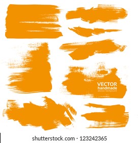 Hand-drawing orange textures of brush strokes in random shape