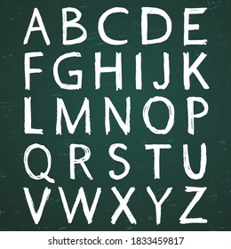 Hand-drawn alphabet. Calligraphy font. Modern chalk lettering. Letters on the green board