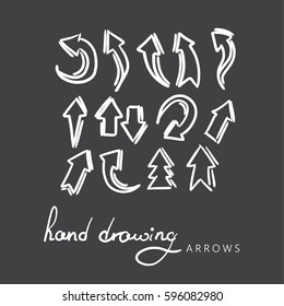 hand-drawn arrows on black background, vector set.