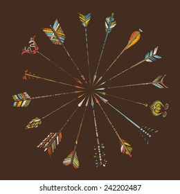 Hand-drawn arrows on brown background. Vintage ethnic illustration for your design.