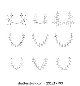Hand-drawn branches brackets graphic design elements set. Useful for wedding invitations, congratulations and greeting cards.