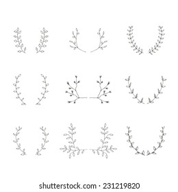 Hand-drawn branches brackets graphic design elements set. Useful for wedding invitations, congratulations and greeting cards.