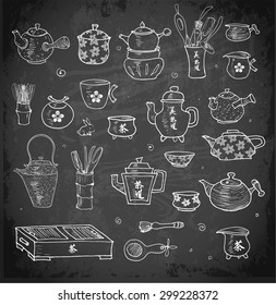 Hand-drawn Chinese and Japanese tea objects on blackboard. Tea ceremony, teapots, tea bowls and other elements in sketchy style. 