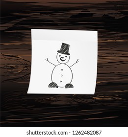 Hand-drawn christmas snowman on yellow sticker and notepad. Vector on wooden background
