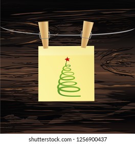 Hand-drawn christmas tree  yellow note. Greeting card. Vectoron wooden background