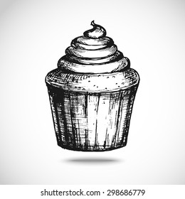 Hand-drawn cupcake sketch, black and white, isolated vector illustration.
